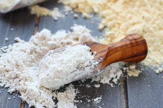 Gluten free oat flour in wooden scoop