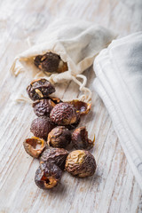 Nutshells of soapnuts in a cotton bag for laundry