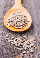 Sunflower seeds on a wooden spoon