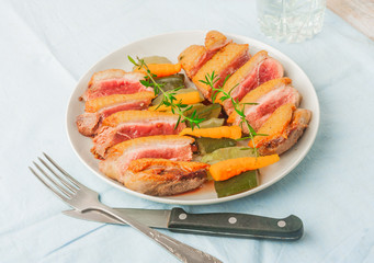 Baked duck breast with zucchini and carrots