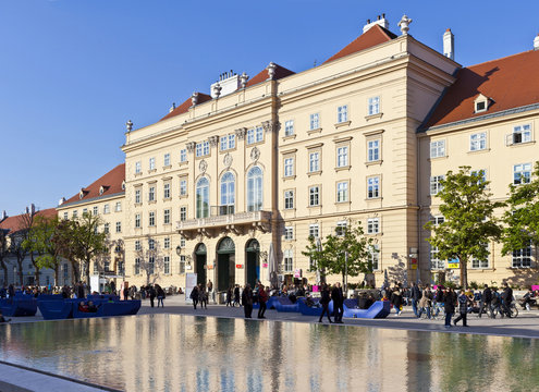 People enjoy a sunny afternoon at the Museumsquartier Vienna