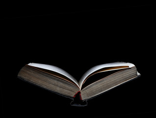Old open book isolated with space for text