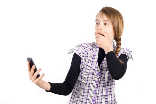 Shocked Girl Covering Her Mouth With Hand and Looking at Phone 
