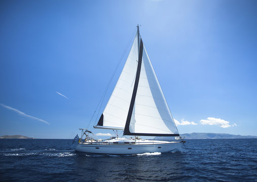 Fototapeta Sailing Yacht from sail regatta race on blue water Sea.
