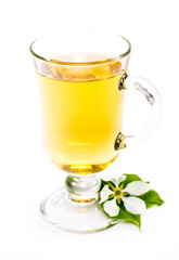 isolated glass of apple drink and flower