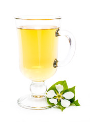 isolated glass of apple juice and flower