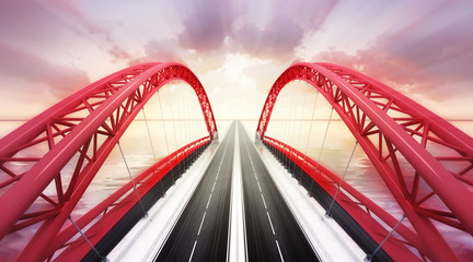 red highway bridge across water at sunset