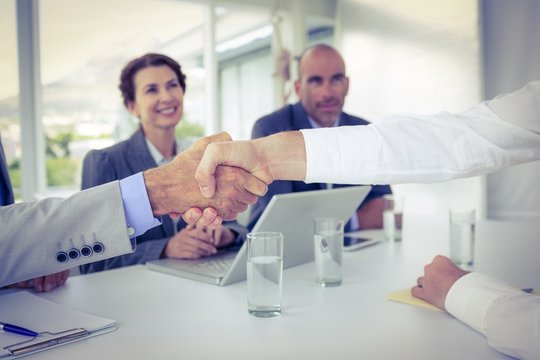 Business people shaking hands at interview