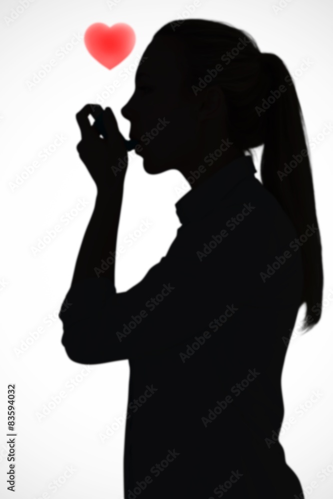 Aufkleber composite image of beautiful blonde using an asthma inhaler