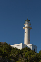 Fototapeta na wymiar Lighthouse on blue background