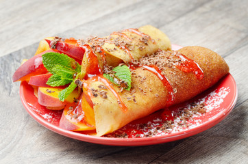 Crepe with peaches and chocolate
