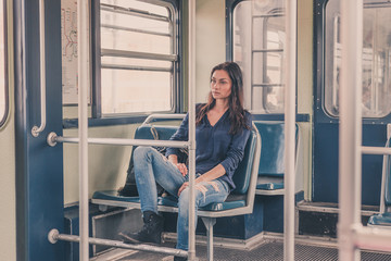 Beautiful girl posing in a metro car