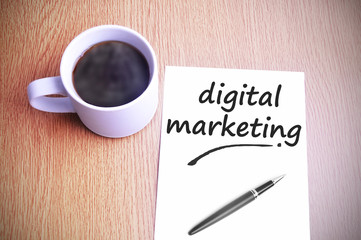 Coffee on the table with note writing digital marketing