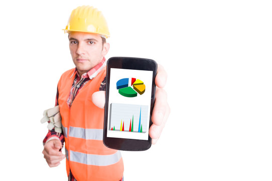 Builder showing smartphone with financial charts - Powered by Adobe