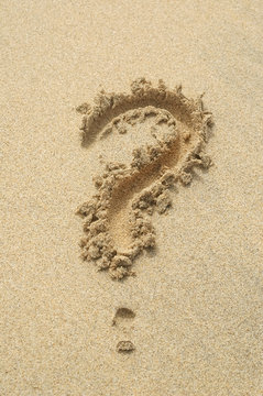 question mark written in sand