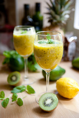 Smoothie with kiwi, lime, orange and mint