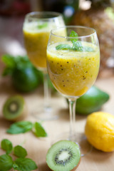 Smoothie with kiwi, lime, orange and mint