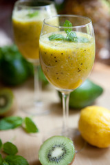Smoothie with kiwi, lime, orange and mint