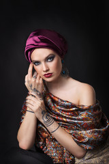 beautiful woman in oriental style with mehendi in hijab