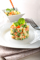 Russian salad with peas, carrots, potatoes and mayonnaise - 83600424