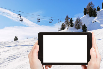 photo of ski lift and slope of Dolomites mountains