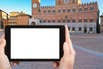 tourist photographs Piazza del Campo in Siena, Italy