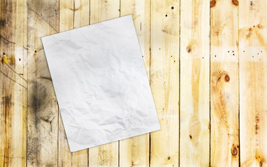 Close up white paper on old grunge wooden background