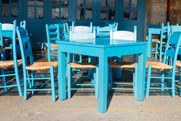 Fototapeta na wymiar cafe with blue chairs, Crete, Greece