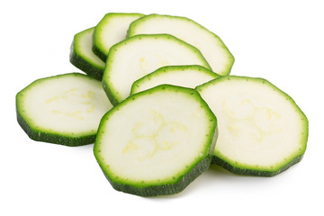 slices of green zucchini isolated on white