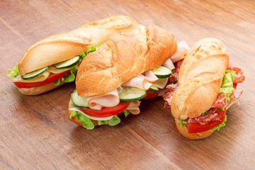 sandwiches on wooden table