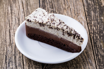 Chocolate dessert on wooden background.