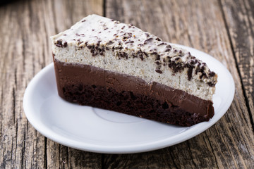 Chocolate dessert on wooden background.