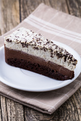 Chocolate dessert on wooden background.