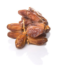 Date fruits over white background