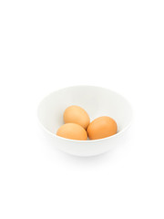 Eggs in white bowl isolated on white background