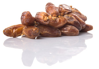 Date fruits over white background