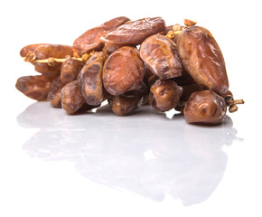 Date fruits over white background