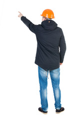 Naklejka premium Back view of pointing young men in parka and helmet.