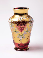 empty red and gold ornate glass vase