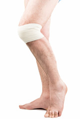 man with elastic bandage on knee