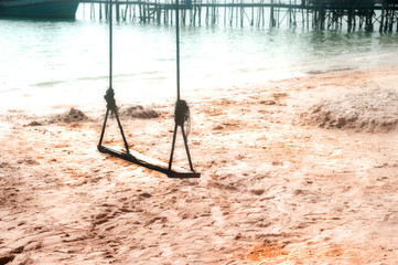 Swings on the tropical beach.
