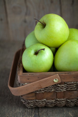 Ripe green apples (Golden Delicious) in a basket 