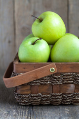 Ripe green apples (Golden Delicious) in a basket 