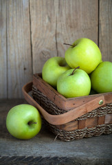 Ripe green apples (Golden Delicious) in a basket 