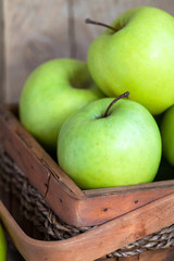 Ripe green apples (Golden Delicious) in a basket 