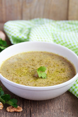 Traditional soup kharcho of beef broth with walnuts, cilantro