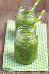 Healthy green smoothie made from spinach, kiwi, bananas 