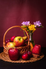 Fresh Red Apples, Fruit Basket and Spring Flowers