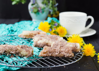 Cookies rolls with rhubarb and cinnamon on a dark background