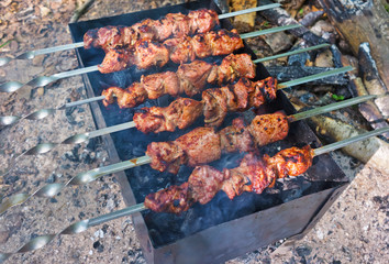 Grilling marinated meat on a grill